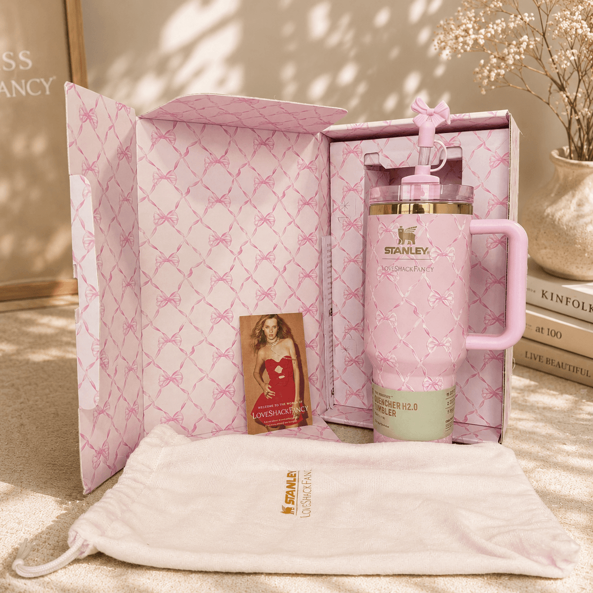 Pink Stanley mug with matching pouch and photo album in a decorative box.