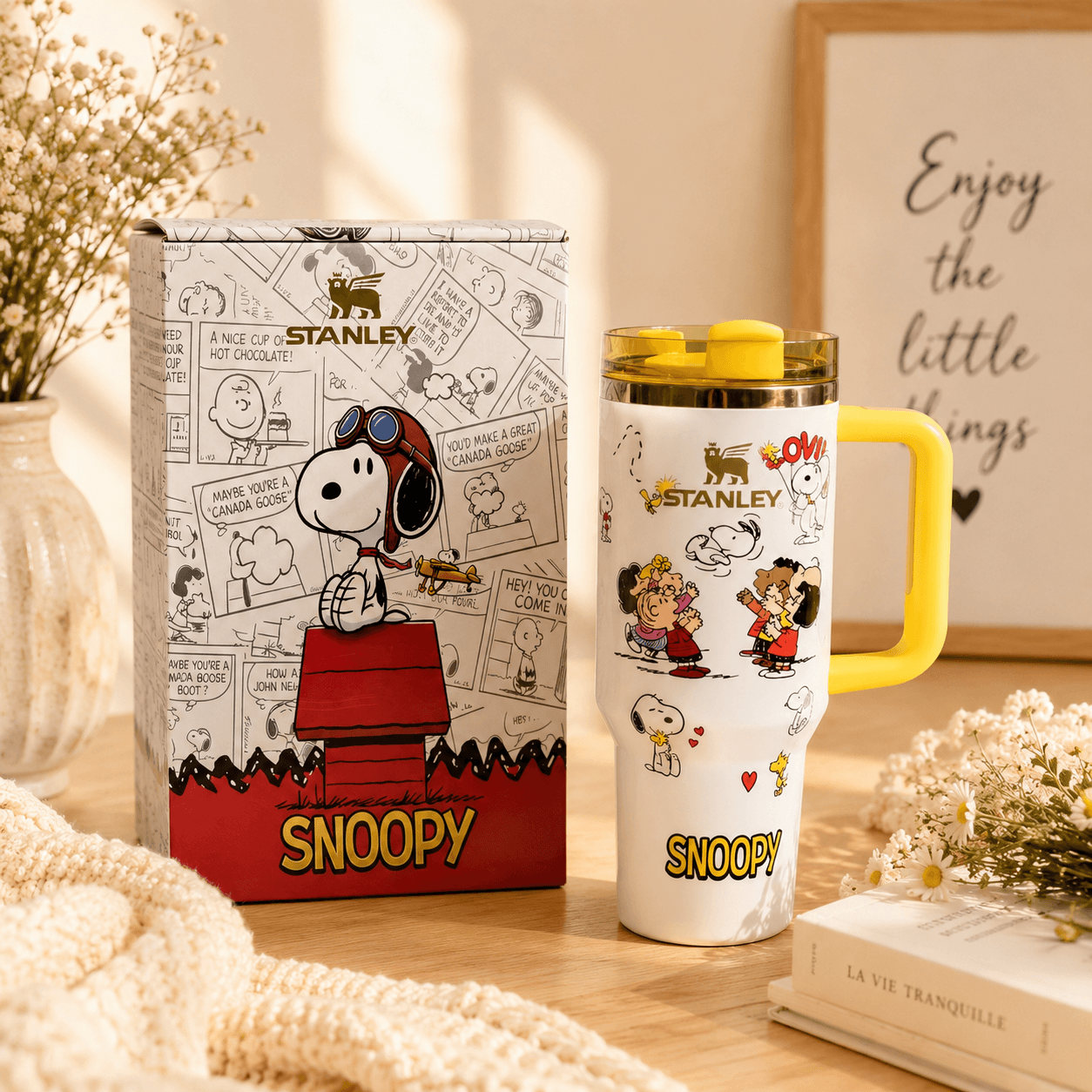 Stanley Snoopy mug with packaging on a decorative surface