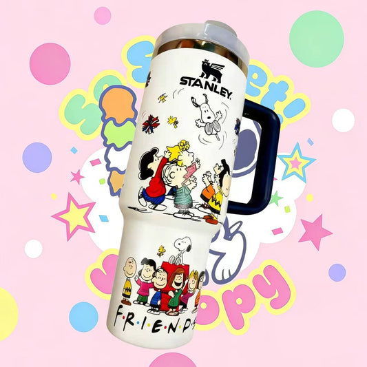 Stanley tumbler with Peanuts character designs on a colorful polka dot background