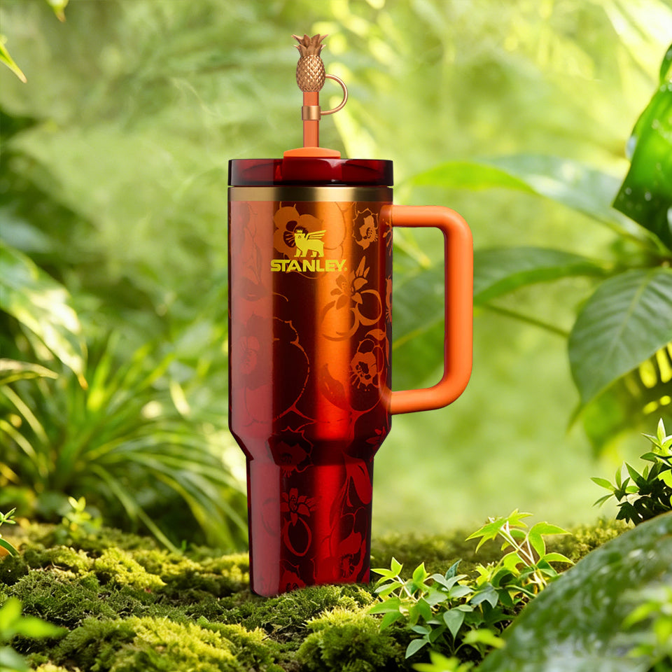 Red Stanley mug with handle in a natural setting