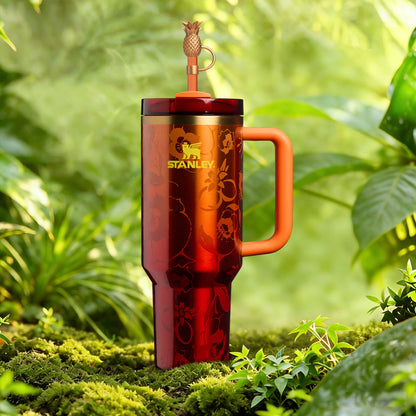 Red Stanley mug with handle in a natural setting
